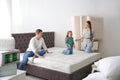 Happy family choosing mattress in store Royalty Free Stock Photo