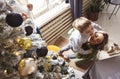 Happy family on Christmas day, mother and little son having fun while decorating xmas tree at home Royalty Free Stock Photo