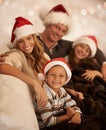 Happy family, christmas hat or bonding on house or home living room sofa in celebration holiday or festive vacation Royalty Free Stock Photo