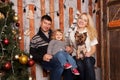 Happy family Christmas. Mother, father, baby and dog Royalty Free Stock Photo