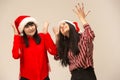 Happy family in Christmas sweater posing on a red background in the studio. Royalty Free Stock Photo