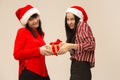 Happy family in Christmas sweater posing on a red background in the studio. Royalty Free Stock Photo