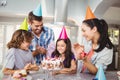 Happy family clapping during birthday celebration