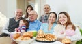 Happy family communicate around tea