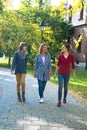 Happy family communicating while walking in the park. Royalty Free Stock Photo