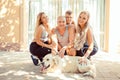 Happy family concept. Daughter, son, mom and dad, dog in front of the house sitting posing looking at you camera home window door Royalty Free Stock Photo