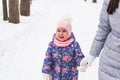 Happy family concept - Mother and child girl on a winter walk in nature. Royalty Free Stock Photo