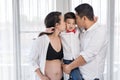 Happy family concept, pregnant mother and father kissing boy Royalty Free Stock Photo