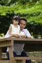 Young father spending time with his daughter at park during weekend Royalty Free Stock Photo