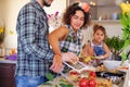 Happy family cooking food in a home kitchen. Royalty Free Stock Photo