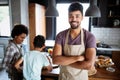 Happy family cooking together food in the kitchen Royalty Free Stock Photo