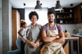 Happy family cooking together food in the kitchen Royalty Free Stock Photo