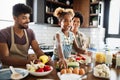 Happy family cooking together food in the kitchen Royalty Free Stock Photo