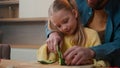 Happy family cooking vegan dinner vegetarian food together Caucasian father teach kid girl little 10s child daughter dad