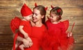 Happy family with costumes devil prepares for Halloween Royalty Free Stock Photo