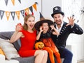 Happy family in costumes for halloween at home Royalty Free Stock Photo