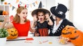 Happy family in costumes for halloween at home Royalty Free Stock Photo