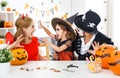 Happy family in costumes for halloween at home Royalty Free Stock Photo