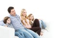 Happy family on the couch isolated.