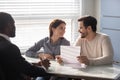 Happy family couple clients meeting african american financial consultant. Royalty Free Stock Photo