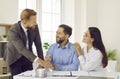 Happy family couple signing contract in modern office Royalty Free Stock Photo