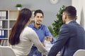 Happy family couple signing contract together in office Royalty Free Stock Photo