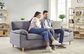 Happy family couple using laptop computer sitting on couch at home Royalty Free Stock Photo