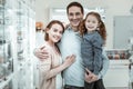 Happy family cuddling and smiling in the pharmacy Royalty Free Stock Photo