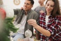 Happy family with cute child decorating Christmas tree together at home, focus on hand Royalty Free Stock Photo