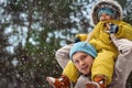 Happy family Dad and baby sy on a winter walk in the forest. Concept for christmas, family, relatives, vacations, fresh air Royalty Free Stock Photo