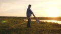 Happy family. Dad is circling a cheerful daughter, silhouette at sunset. Father and little child girl play outdoors, dad Royalty Free Stock Photo