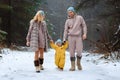 Happy family Dad, mom and baby sy on a winter walk in the forest. Concept for christmas, family, relatives, vacations, fresh air Royalty Free Stock Photo