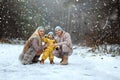 Happy family Dad, mom and baby sy on a winter walk in the forest. Concept for christmas, family, relatives, vacations, fresh air Royalty Free Stock Photo