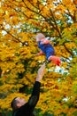 Happy family Dad throws child daughter up Royalty Free Stock Photo