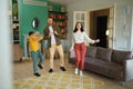 Happy family dancing in living room spending active free time at home Royalty Free Stock Photo