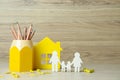 Happy Family Day. Figures of parents, their children, house and stationery on table, space for text Royalty Free Stock Photo