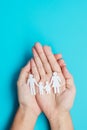 Happy Family day. hands holding paper shape cutout with Father, Mother and Children. international day of families, Warm home,