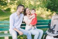 Happy family day holiday. Young parents. Caucasian smiling laughing mother and father with baby daughter in park. Happy family mom Royalty Free Stock Photo