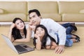 Happy family daydreaming on the floor at home Royalty Free Stock Photo