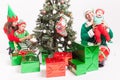 Happy family decorating Christmas tree, dressed in elf costumes Royalty Free Stock Photo