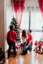 happy family decorating christmas tree at home Royalty Free Stock Photo