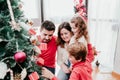 happy family decorating christmas tree at home Royalty Free Stock Photo