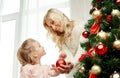 Happy family decorating christmas tree at home Royalty Free Stock Photo