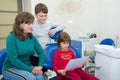A happy family in a dental office. A family visit to a dentis Royalty Free Stock Photo