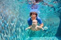 Happy family dive underwater with fun in swimming pool Royalty Free Stock Photo