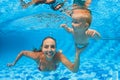 Happy family dive underwater with fun in swimming pool Royalty Free Stock Photo