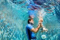 Happy family dive underwater with fun in swimming pool Royalty Free Stock Photo