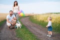 Happy family and dog enjoy outdoor time together Royalty Free Stock Photo