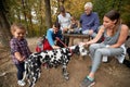 Happy family with a dog having a picnic together; Healthy lifestyle concept Royalty Free Stock Photo