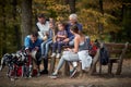 Happy family with a dog having a picnic together; Spring or autumn hiking in nature; camping, travel, tourism,lifestyle,  hike and Royalty Free Stock Photo